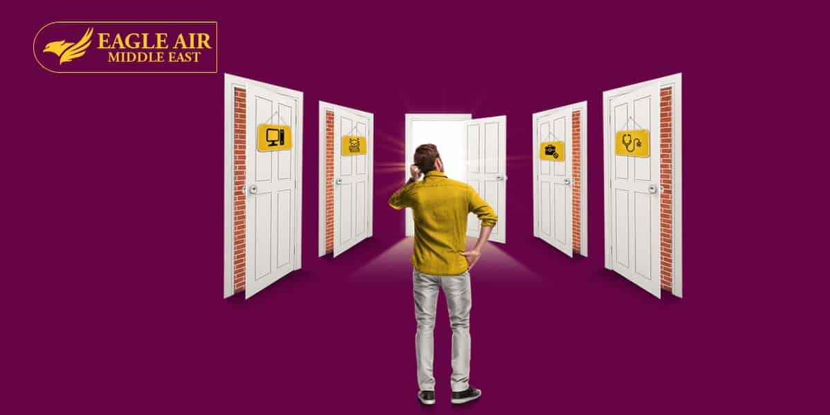 A man standing with multiple doors in front of him, all covered with signs that lead to different professions.
