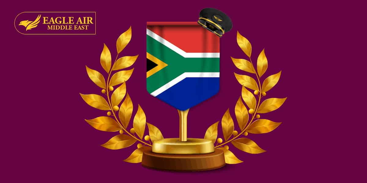 The South African flag with golden olive branches on each side.